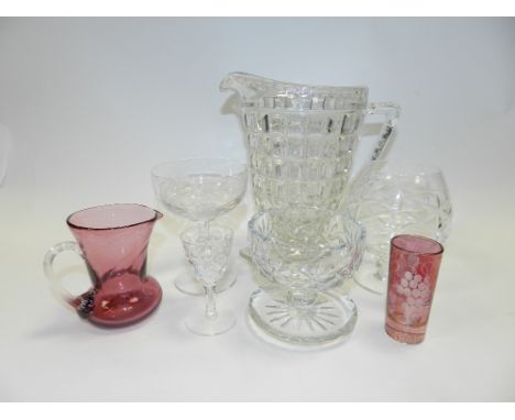 Five trays of glassware including white wines, red wines, brandy balloons, champagnes, two pressed glass jugs, a fruit bowl a