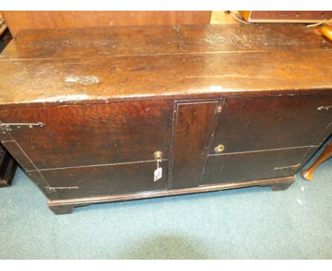 An 18th century oak two door cabinet on bracket feet (a conversion)