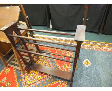 An Edwardian four bar towel rail, a tapestry frame and a fire screen (at fault)