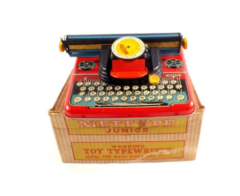 A boxed Mettype Junior typewriter with leaflet