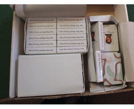 Various packs of Saddam Hussein playing cards