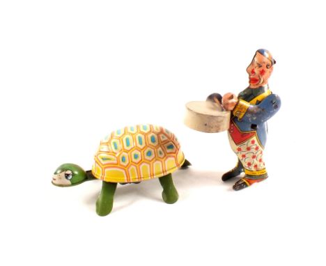 Fairylite tin plate clockwork drumming clown plus a Japanese clockwork tortoise, marked K