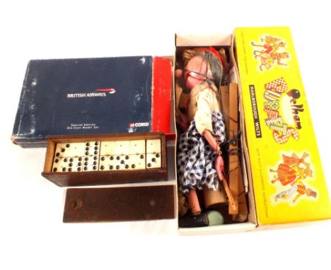 A boxed Corgi British Airways set, Pelham puppet and bone dominoes