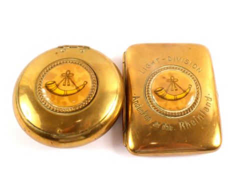 A brass cigarette case marked 'Light-Division' Andenken an das Rheinland with unmarked matching tobacco box