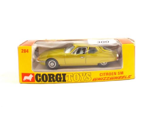 A boxed Corgi 284 Citroen SM with metallic green body