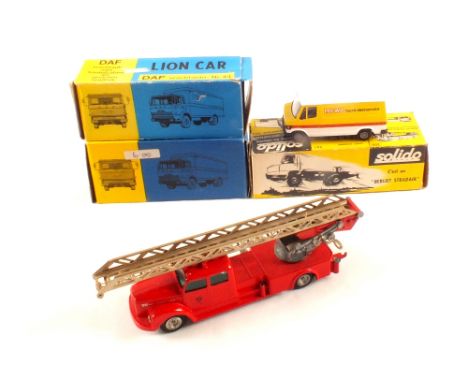 A boxed Solido 306 Camion Berliet Stradder, Lion Cars 43 DAF Vrachtauto Kleenex in blue and silver plus another in orange, bl