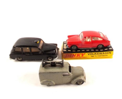 A Budgie 703 London Taxi Cab, Dinky 163 VW 1600 red on box base plus 34c loudspeaker van in grey and black