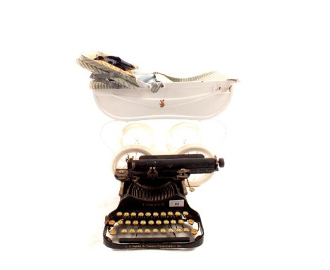 An L.C.Smith & Corona childs typewriter plus a dolls pram (no handle)
