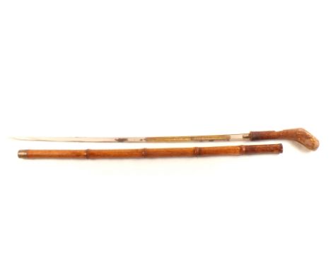 A Mallaca cane sword stick with decorated blade marked Toledo