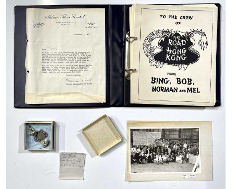 A collection of items issued to cast and crew members following the completion of 'The Road To Hong Kong' (1962) to inc: ring