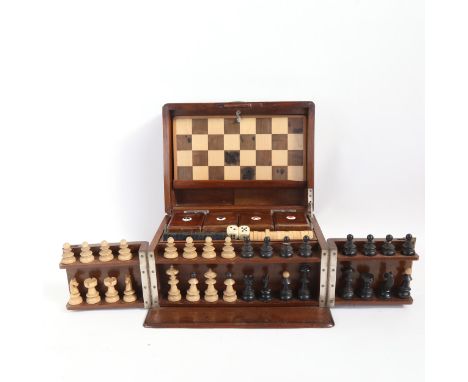 An early 20th century walnut games compendium, the interior fitted with 4 small boxes with enamel playing card suit emblems, 