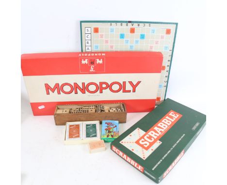 Various Vintage toys and games, including Monopoly, Scrabble, and bone dominos 