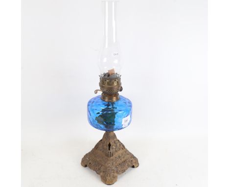 An Antique Duplex brass oil lamp, with blue glass font, overall height 58cm 