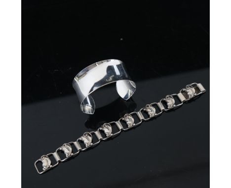 HUGO GRUN - a Danish silver floral design panel bracelet, and a silver torque bangle 