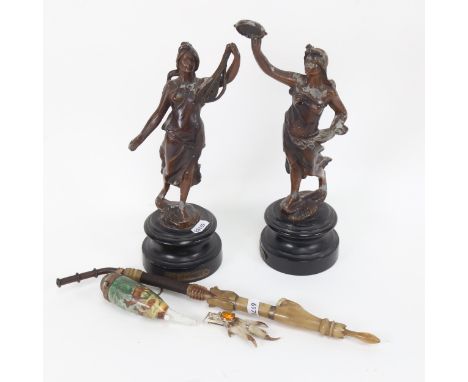 A pair of spelter musician figures on plinths, tallest 29cm, and a pipe, and a rabbit's claw brooch 