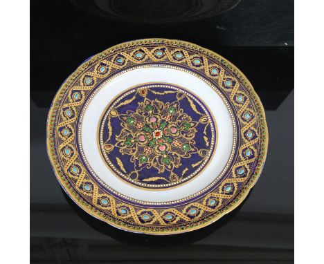 A 19th century gilded and jewelled porcelain cabinet plate, finely painted enamelled decoration on blue ground, no factory ma