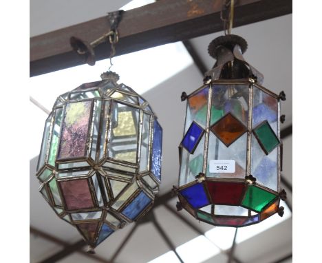 A Moroccan style lantern, with coloured glass panels, and a smaller lantern, height 31cm approx 