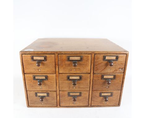 A Vintage oak office card index filing chest of 9 drawers, width 47cm, height 29cm 