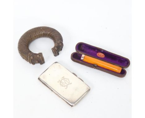 A small silver cigarette case, amber cheroot holder with 9ct mount, and an African slave bangle (3) 