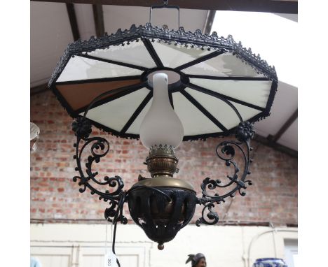 A wrought-iron framed brass ceiling oil lamp, with milk glass panels and milk glass chimney, overall height approx 90cm, shad