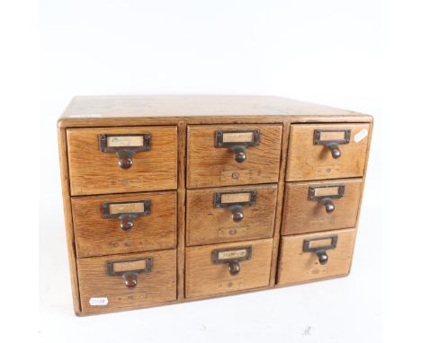 A Vintage oak office card index filing chest of 9 drawers, width 47cm, height 29cm 