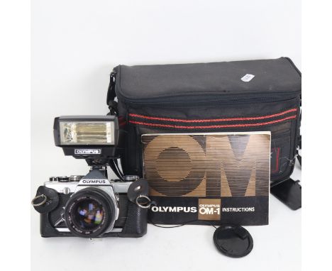 OLYMPUS - a Vintage OM-1 35mm single-lens reflex camera, with Olympus 50mm 1:1.4 lens, with Olympus T32 electronic flash, and