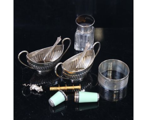 A pair of miniature silver boat design salts and spoons, silver napkin ring, a silver and green enamel bobbin holder etc 