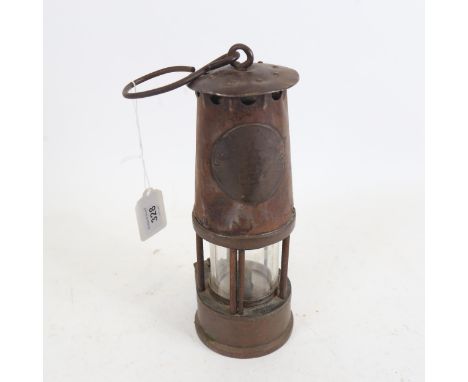 A brass and iron miner's lamp, by The Protector Lamp & Lighting Co Ltd, height 23cm 