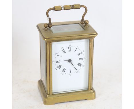 A brass carriage clock, height 14cm overall 