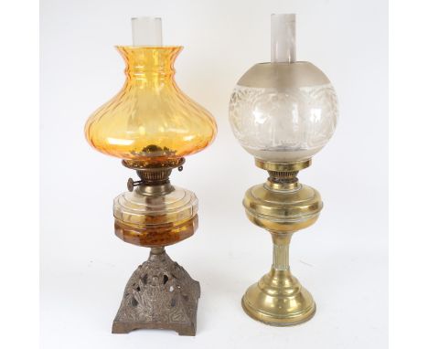 A brass oil lamp with amber glass font and shade, and another glass column oil lamp, largest height 56cm (2) 