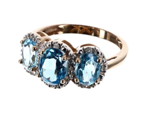 9ct blue topaz and diamond triple cluster ring, the cluster 10mm x 19mm, 3.4gm, ring size P