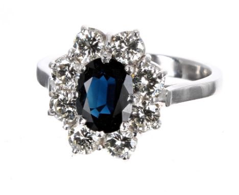 Good quality platinum sapphire and diamond cluster ring, the sapphire 1.30ct approx, in a surround of round brilliant-cut dia