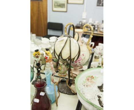 BRONZED ART NOUVEAU STYLE METAL TABLE LAMP WITH MOTTLED GLASS FLOWER HEAD PATTERN SHADE AND BUDDING STEM ALONGSIDE, LILY PAD 