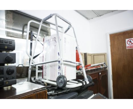 A COLLECTION OF MODERN WALKING AIDES TO INCLUDE A ZIMMER FRAME AND CADDY, CRUTCHES, ETC