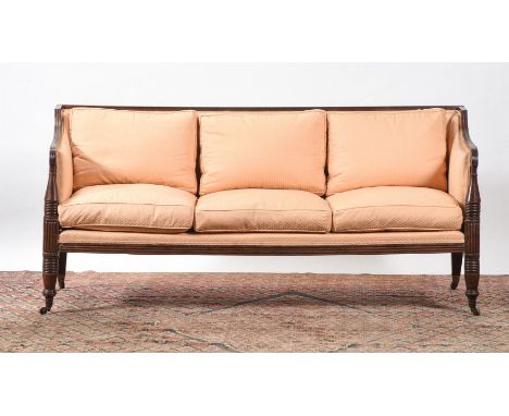 A LATE REGENCY MAHOGANY AND UPHOLSTERED SHOW FRAME SOFA CIRCA 1820 With salmon coloured upholstery 89cm high, 193cm wide, 72c