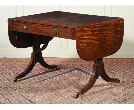 A REGENCY MAHOGANY SOFA TABLE CIRCA 1815 The inside of one drawer with a retailer's label for Norman Adams 72.5cm high, 100cm