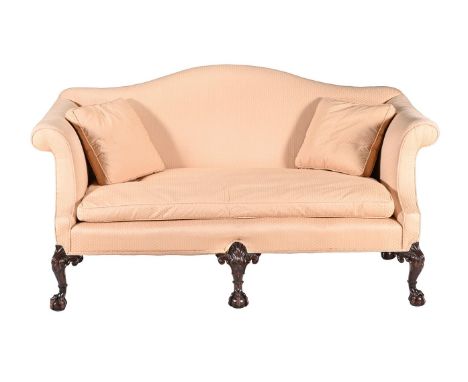A CARVED MAHOGANY SOFA IN GEORGE II STYLE  LATE 19TH CENTURY The 'camel back' and outscrolled arms above carved cabriole legs