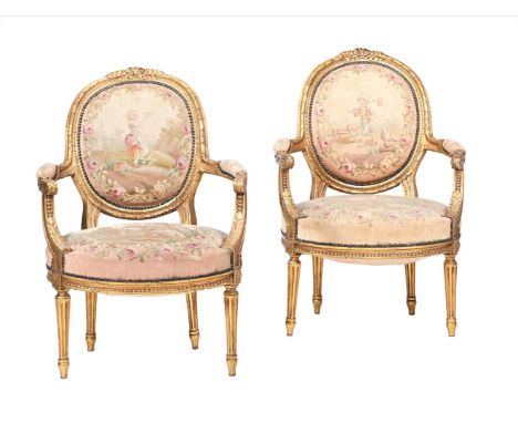 A PAIR OF GILTWOOD FRAMED ARMCHAIRS IN LOUIS XVI STYLE  19TH CENTURY With tapestry style upholstery 96cm high, 65cm wide, 65c