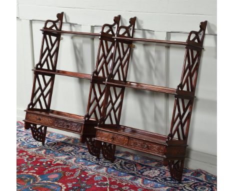 A PAIR OF MAHOGANY HANGING WALL SHELVES IN GEORGE III 'CHIPPENDALE' STYLE  20TH CENTURY 91cm high, 52cm wide, 21cm deep   Con
