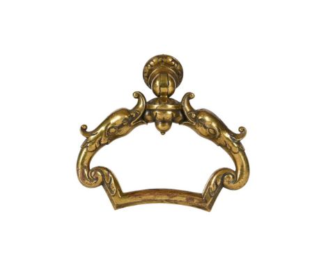 A BRASS DOOR PULL OR KNOCKER  LATE 19TH CENTURY  the handle formed of dolphins  17.5cm high 