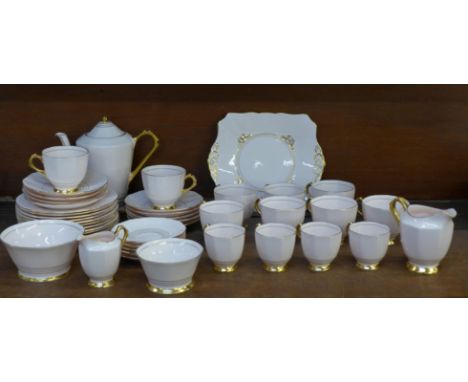 Tuscan china tea and coffee cups and saucers, a coffee pot and two cream jugs and two sugar bowls&nbsp;**PLEASE NOTE THIS LOT
