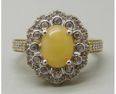 A silver gilt, Ethiopian opal and white zircon cluster ring, P 