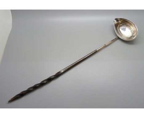 A Georgian silver ladle with baleen handle, worn London hallmark 