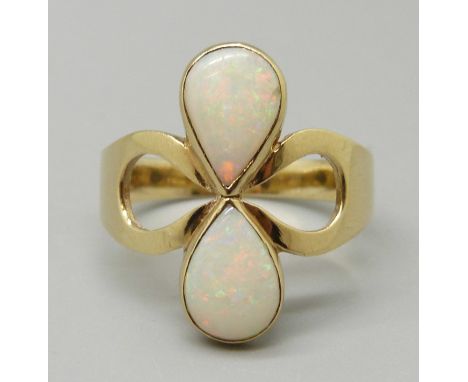 A 9ct gold and opal ring, London 1978, maker CJW, 4.2g, V 