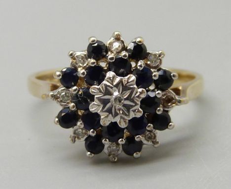 A 9ct gold, diamond and sapphire cluster ring, maker BMJ, 3.4g, Q/R 