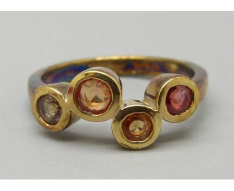 A silver gilt multi-coloured Songea sapphire ring, L 