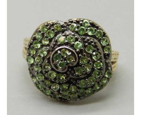 A silver gilt and green stone cluster ring, Q 