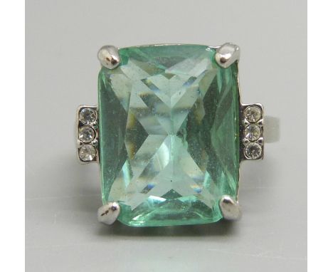 A silver and green stone ring, O 