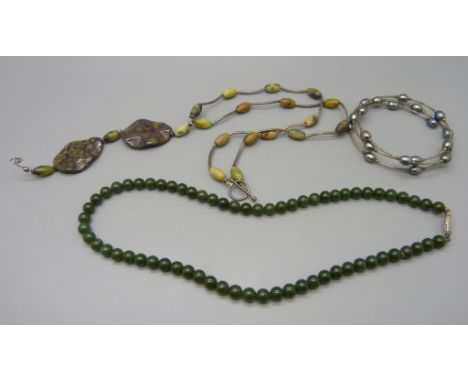 A silver hardstone necklace, a silver and pearl bracelet and a jade necklace 