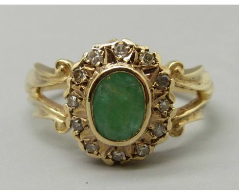 A 9ct gold, emerald and diamond cluster ring, 3.4g, M 